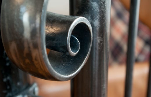 Metal railing up to the sofa area